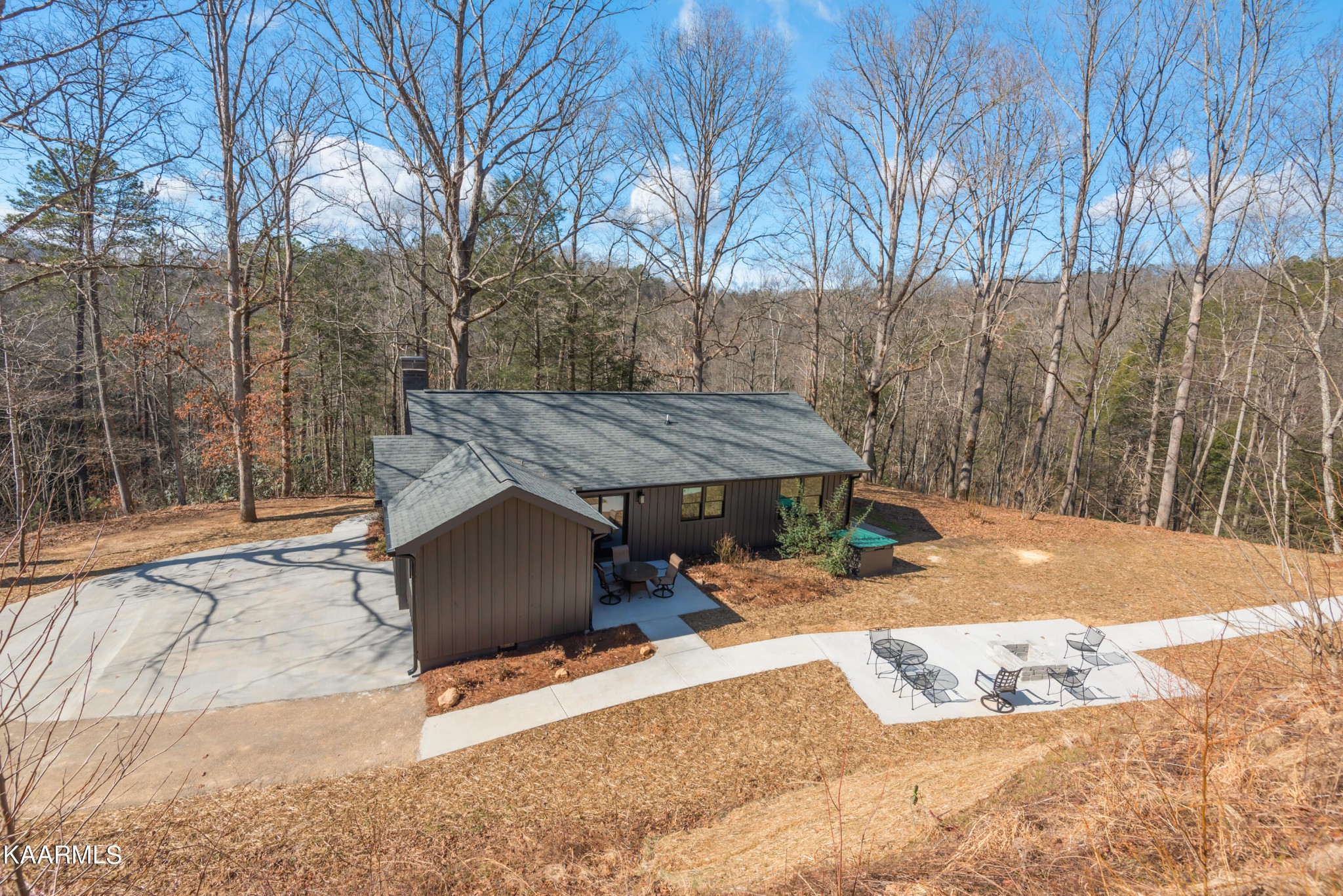 306 Glades Road Gatlinburg, TN 37738 - Photo 4 of 46 a outdoor space with a bench and trees