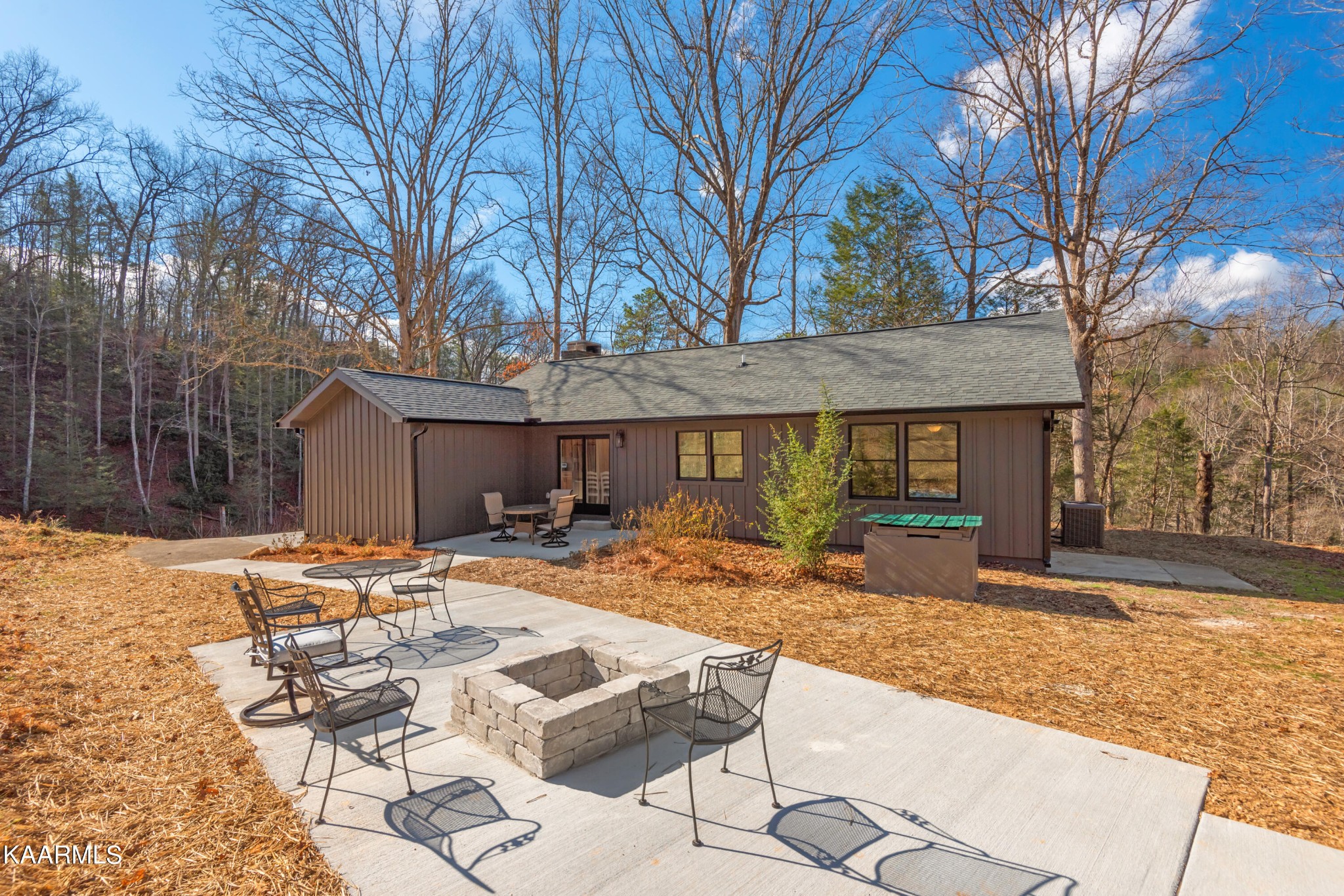 306 Glades Road Gatlinburg, TN 37738 - Photo 43 of 46 a view of a house with backyard and sitting area