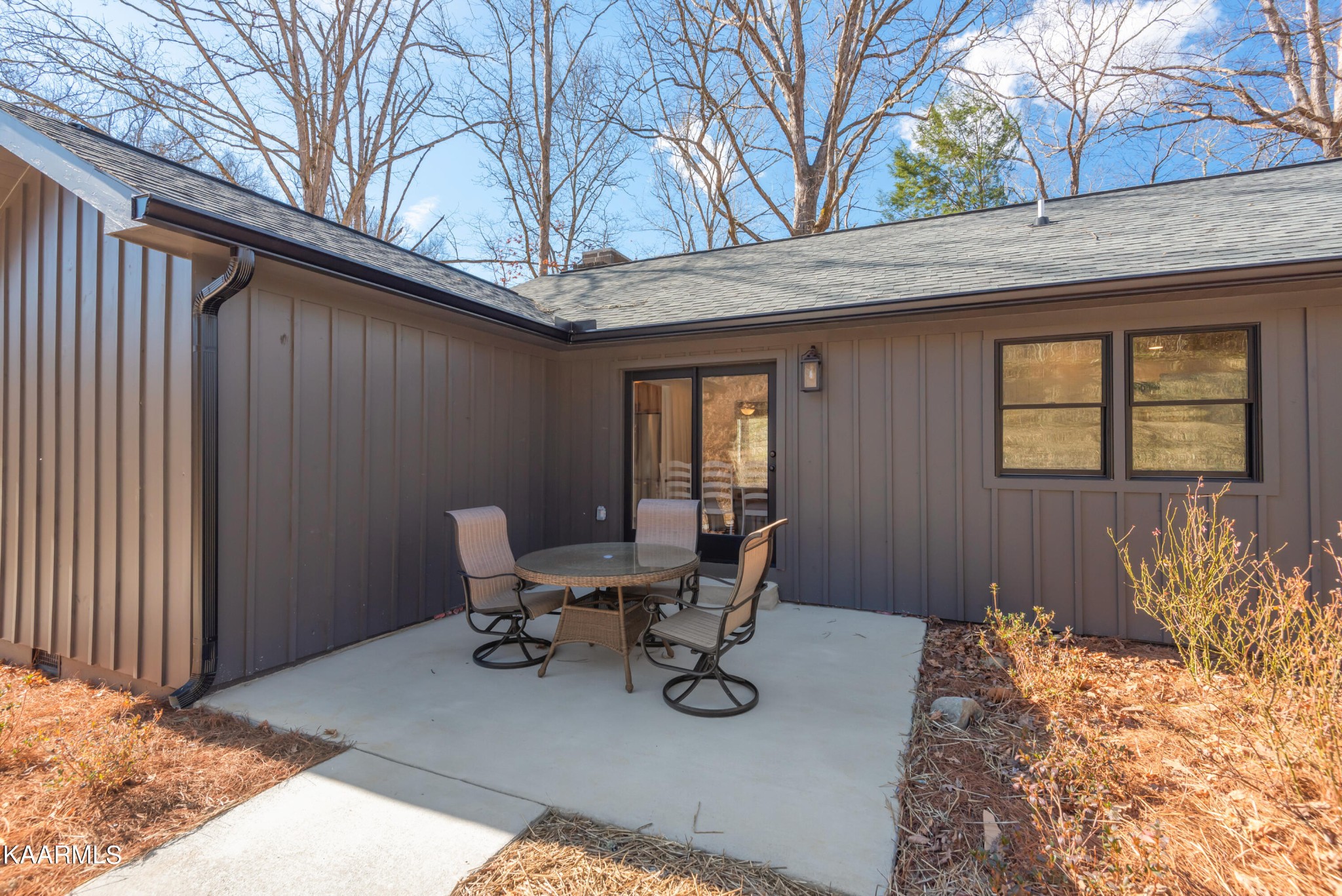 306 Glades Road Gatlinburg, TN 37738 - Photo 44 of 46 a view of a patio with table and chairs and wooden fence