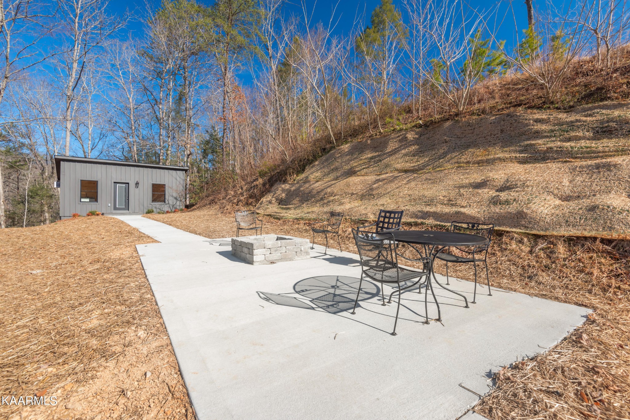 306 Glades Road Gatlinburg, TN 37738 - Photo 5 of 46 a view of a backyard with sitting area