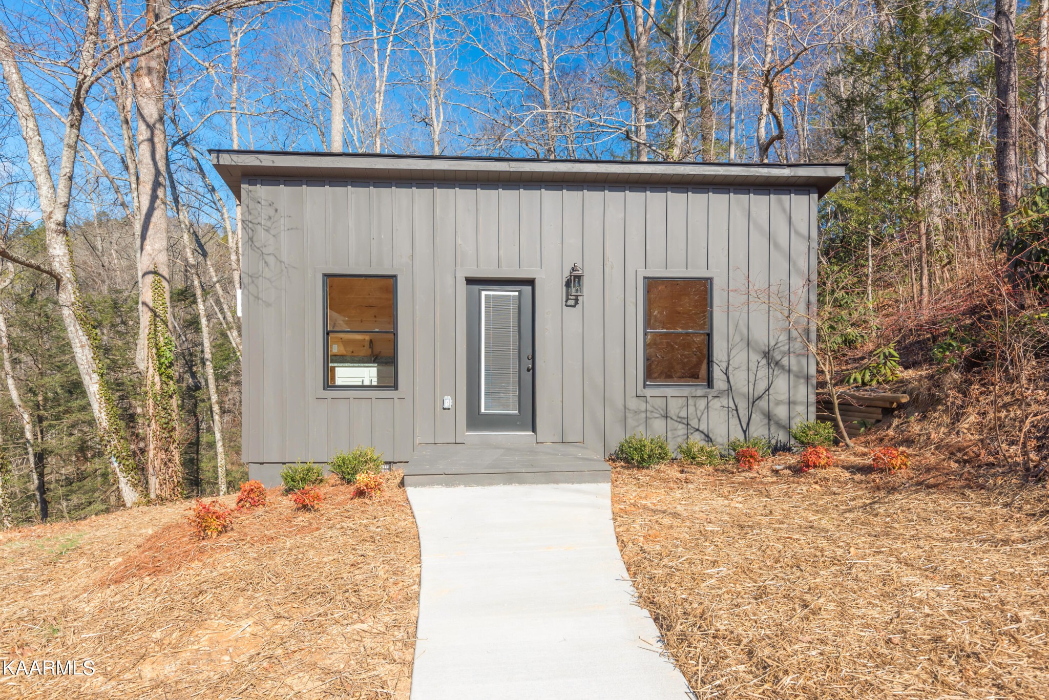 306 Glades Road Gatlinburg, TN 37738 - Photo 7 of 46 a front view of a house with a yard