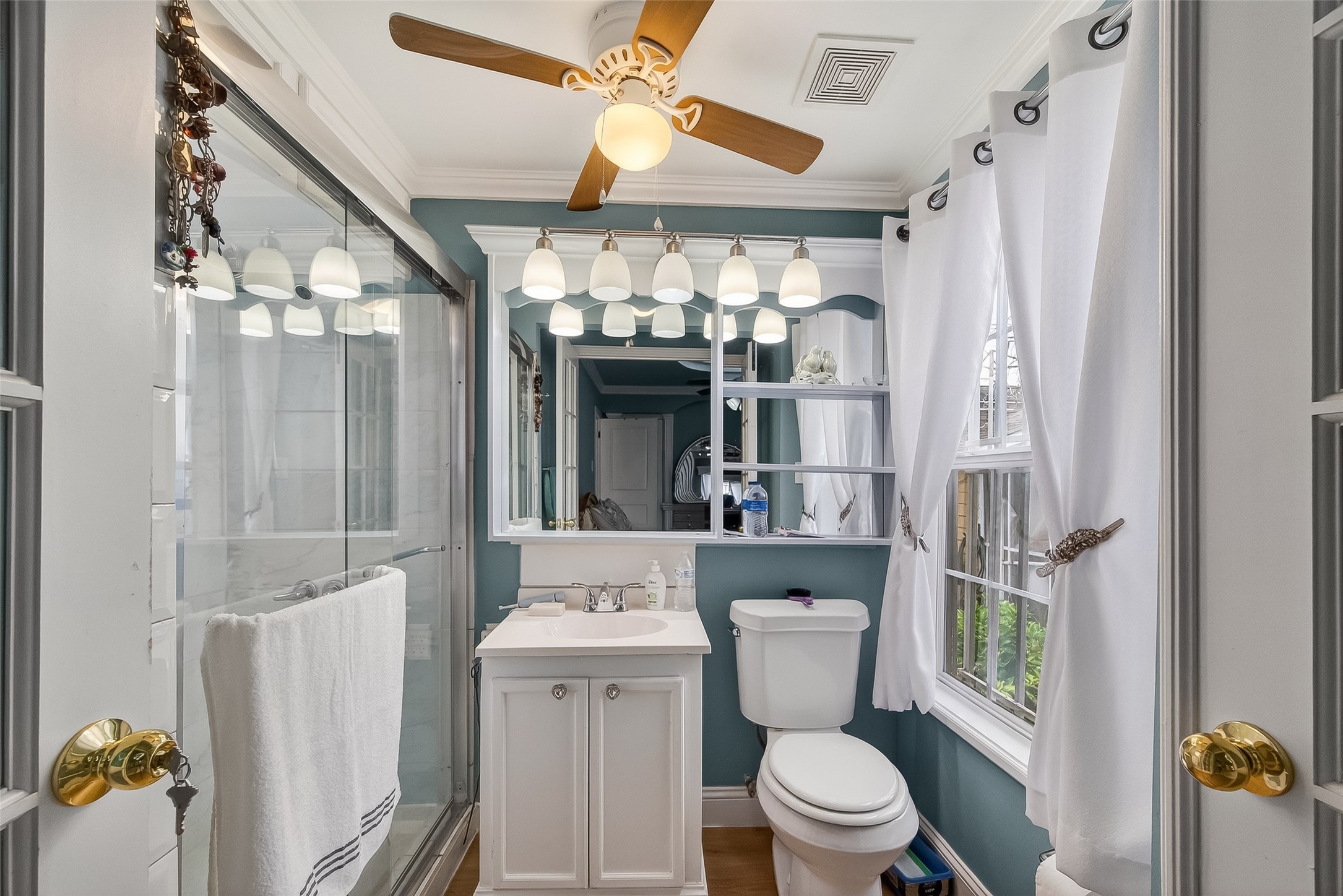 7404 Erath Street Houston, TX 77023 - Photo 12 of 40 a bathroom with a toilet sink and mirror
