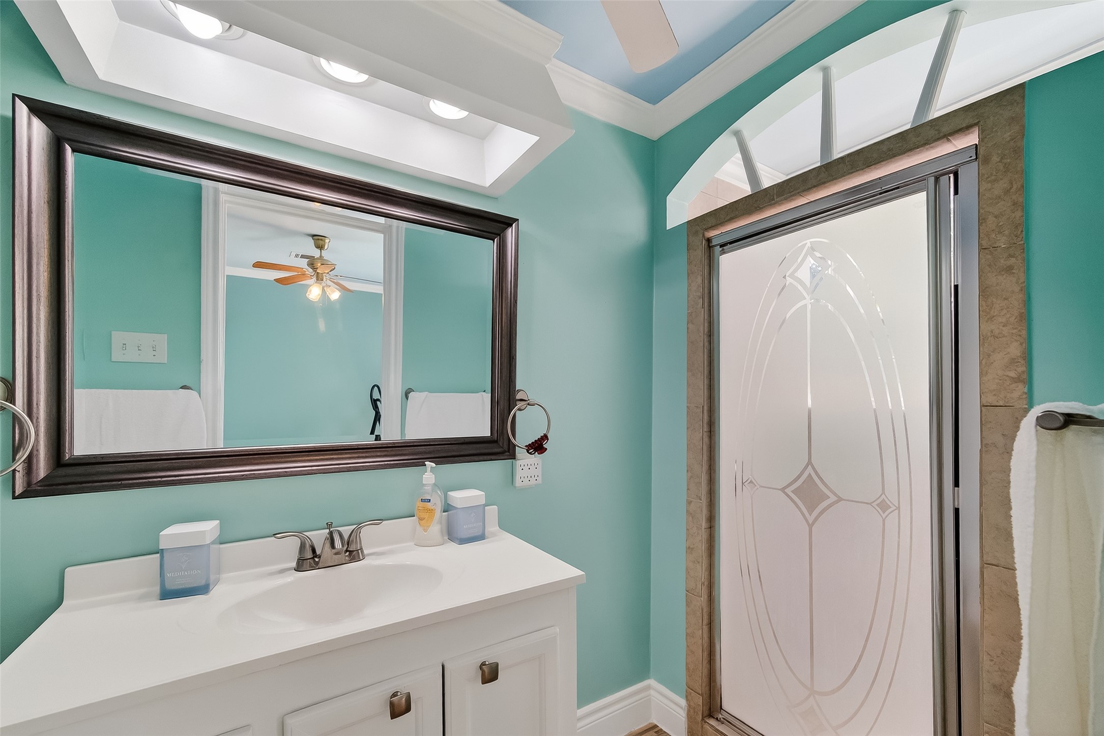 7404 Erath Street Houston, TX 77023 - Photo 20 of 40 a bathroom with a sink a mirror and a toilet