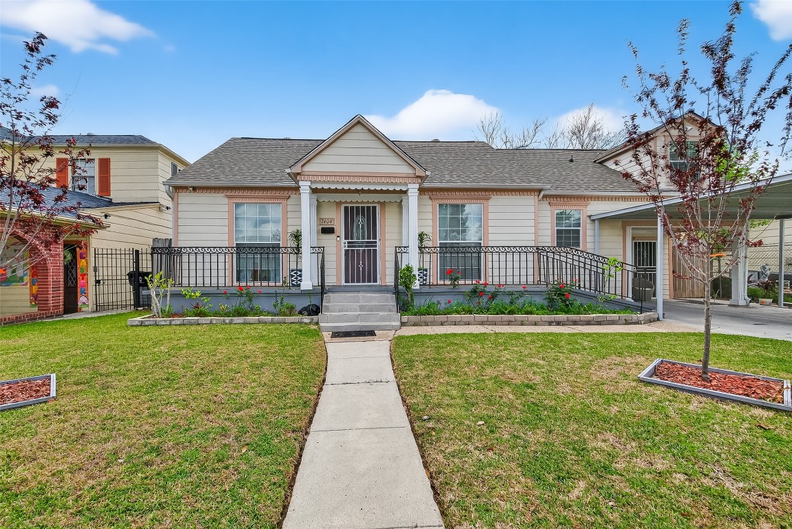 7404 Erath Street Houston, TX 77023 - Photo 2 of 40 a front view of a house with a yard