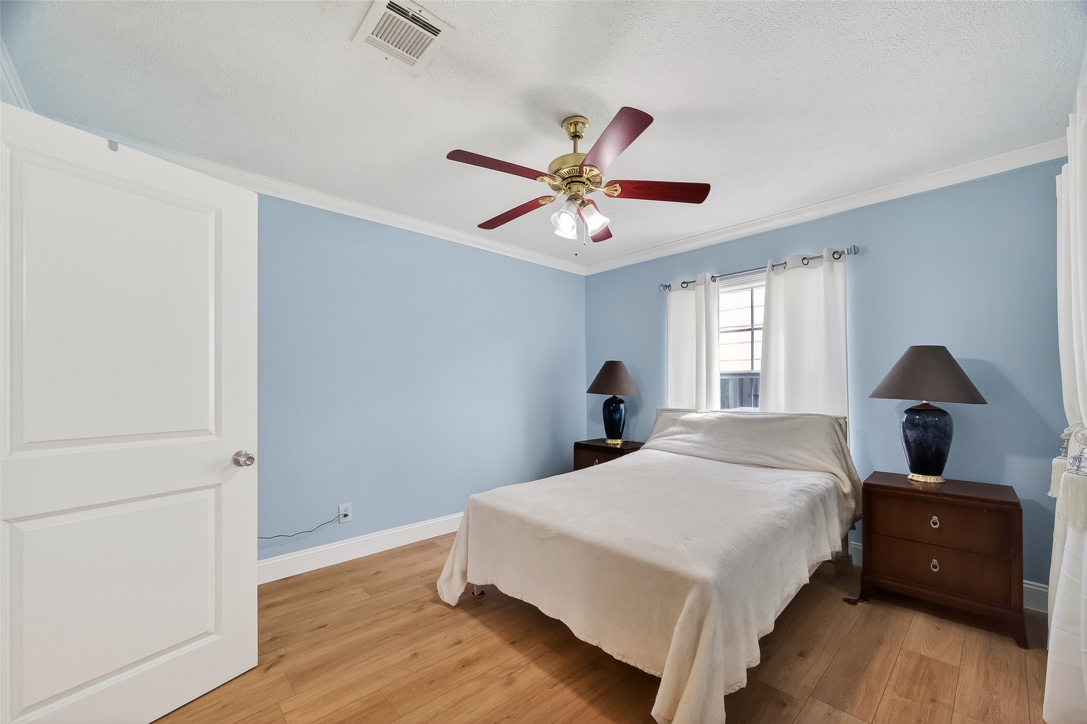 7404 Erath Street Houston, TX 77023 - Photo 23 of 40 a bedroom with a bed and a window