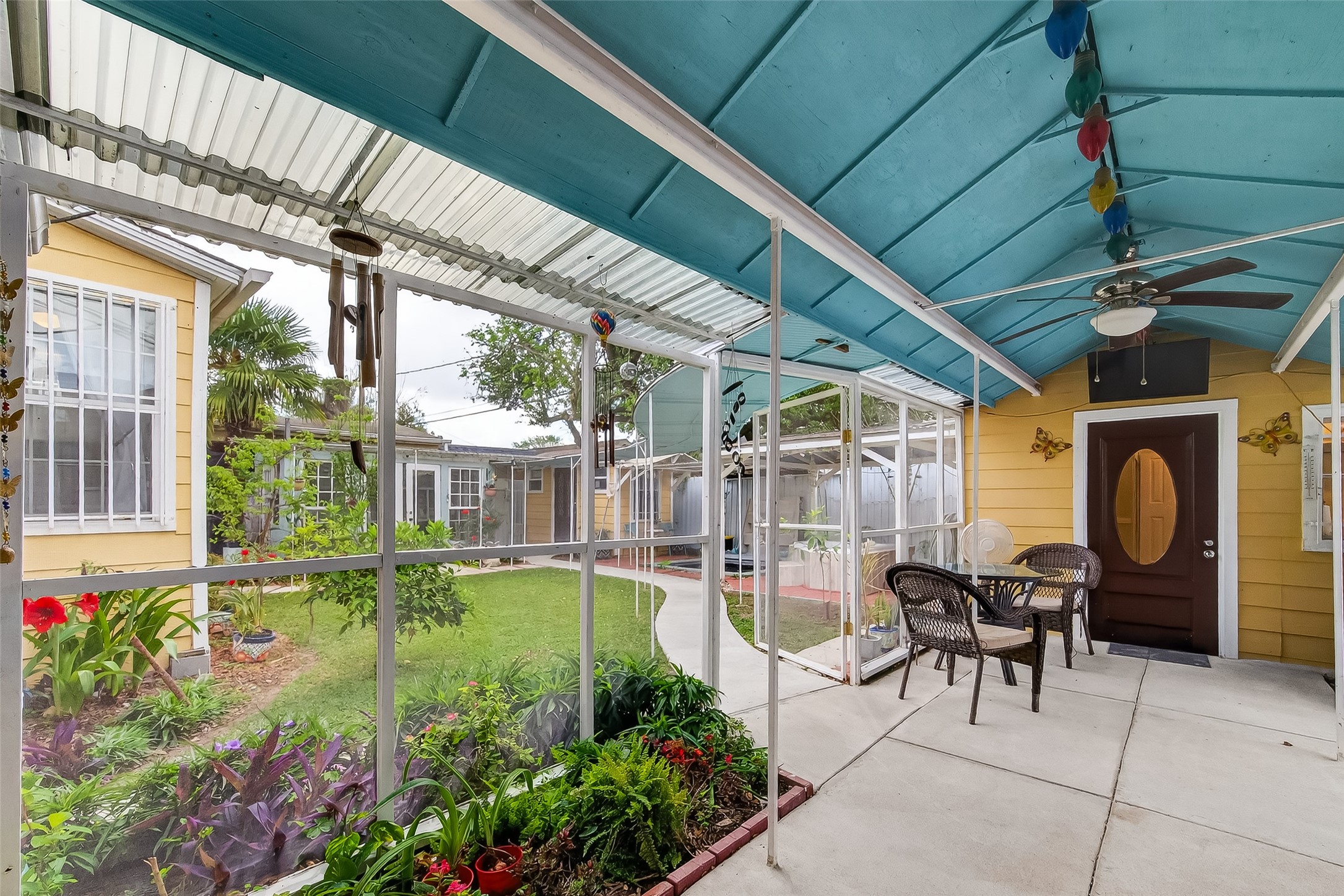 7404 Erath Street Houston, TX 77023 - Photo 24 of 40 a view of a porch with chairs and potted plants