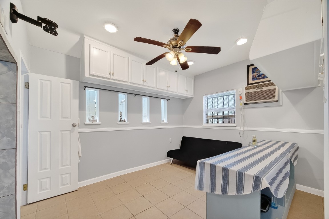 7404 Erath Street Houston, TX 77023 - Photo 27 of 40 a kitchen with stainless steel appliances kitchen island a chandelier
