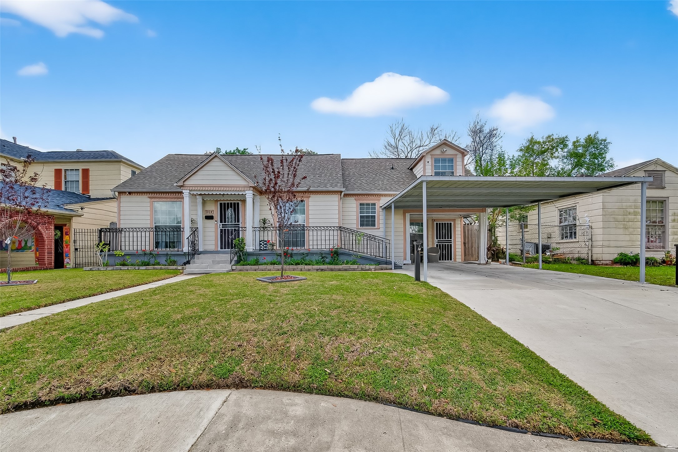 7404 Erath Street Houston, TX 77023 - Photo 3 of 40 a front view of a house with a yard and garage