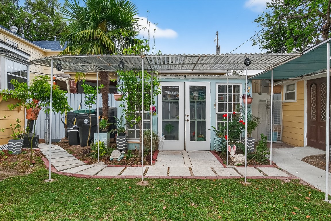 7404 Erath Street Houston, TX 77023 - Photo 31 of 40 a view of a patio with table and chairs under an umbrella