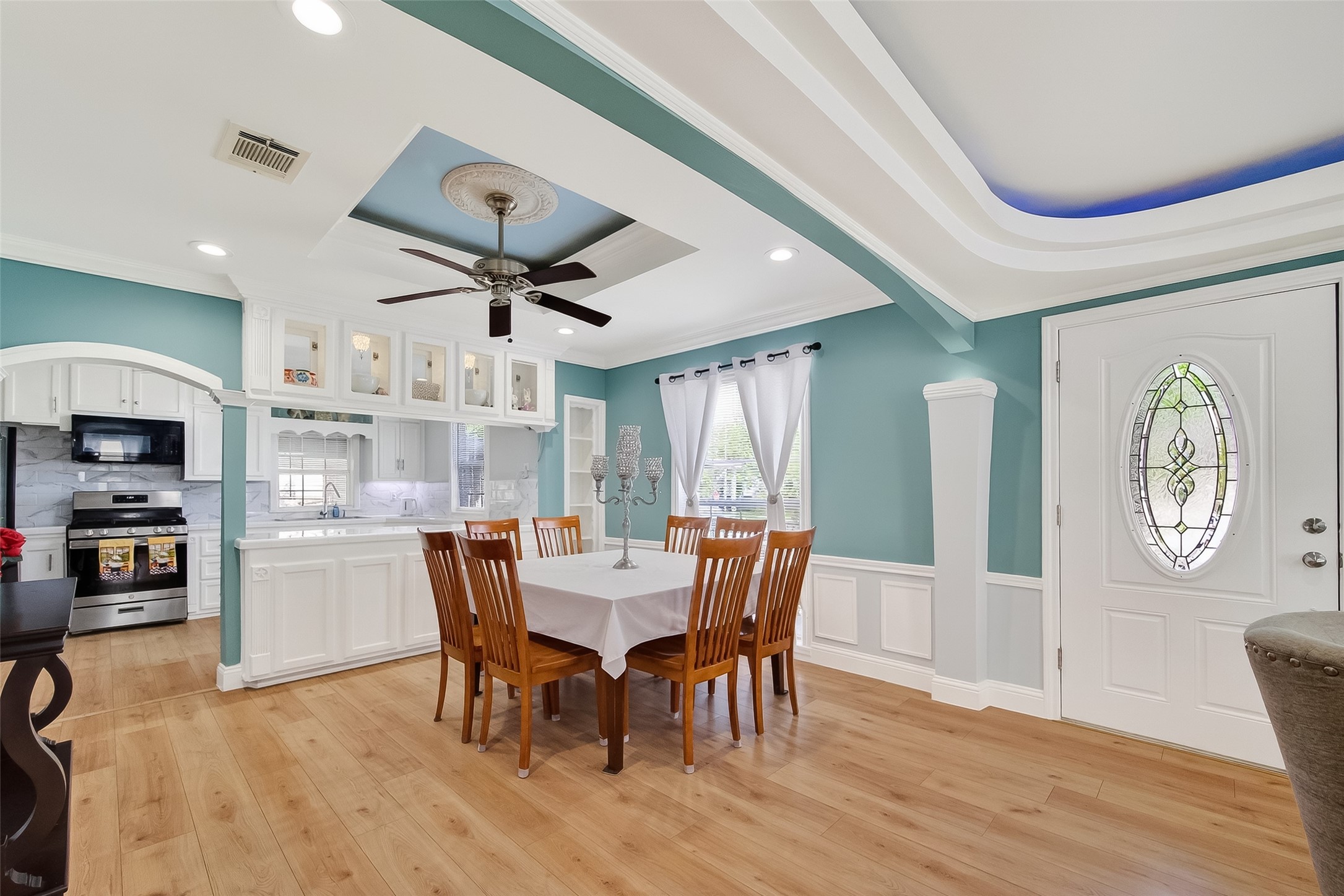 7404 Erath Street Houston, TX 77023 - Photo 6 of 40 a view of a dining room with furniture window and wooden floor