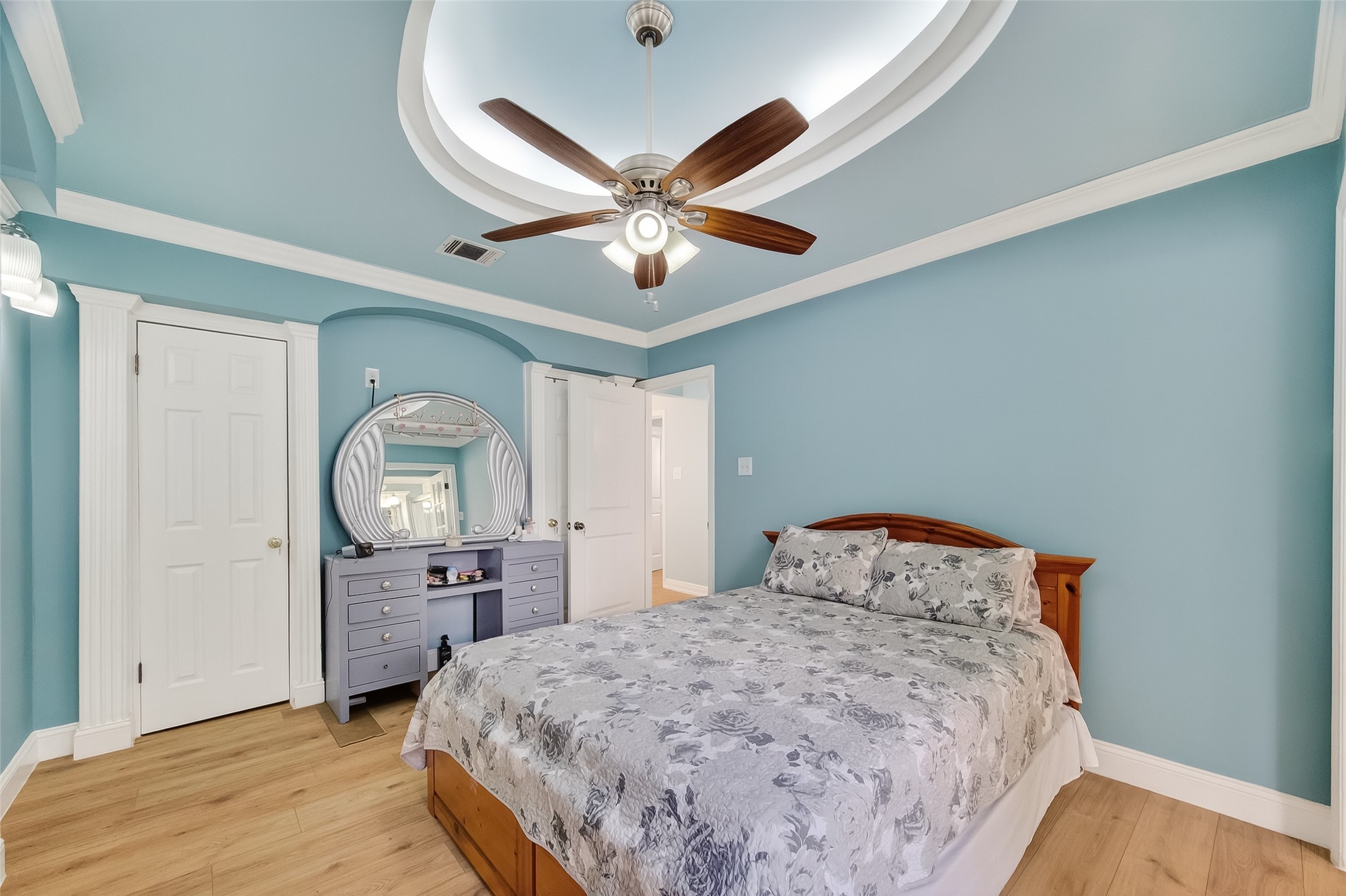 7404 Erath Street Houston, TX 77023 - Photo 10 of 40 a bedroom with a bed and a chandelier