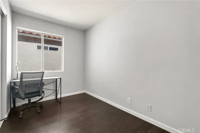 a wooden bench sitting in front of a house