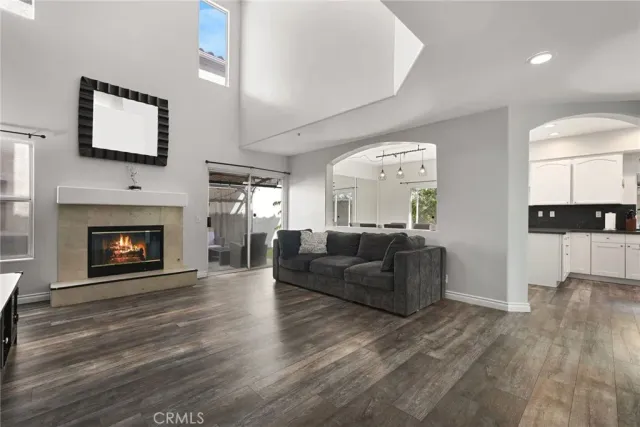 a living room with fireplace furniture and a flat screen tv