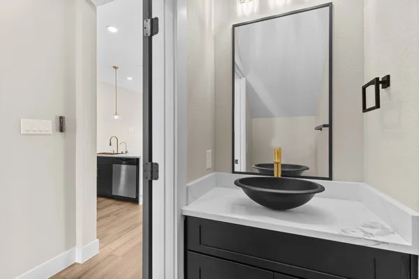 a bathroom with a sink and a mirror