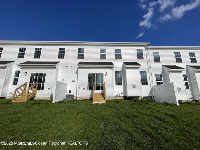 a front view of a building with garden