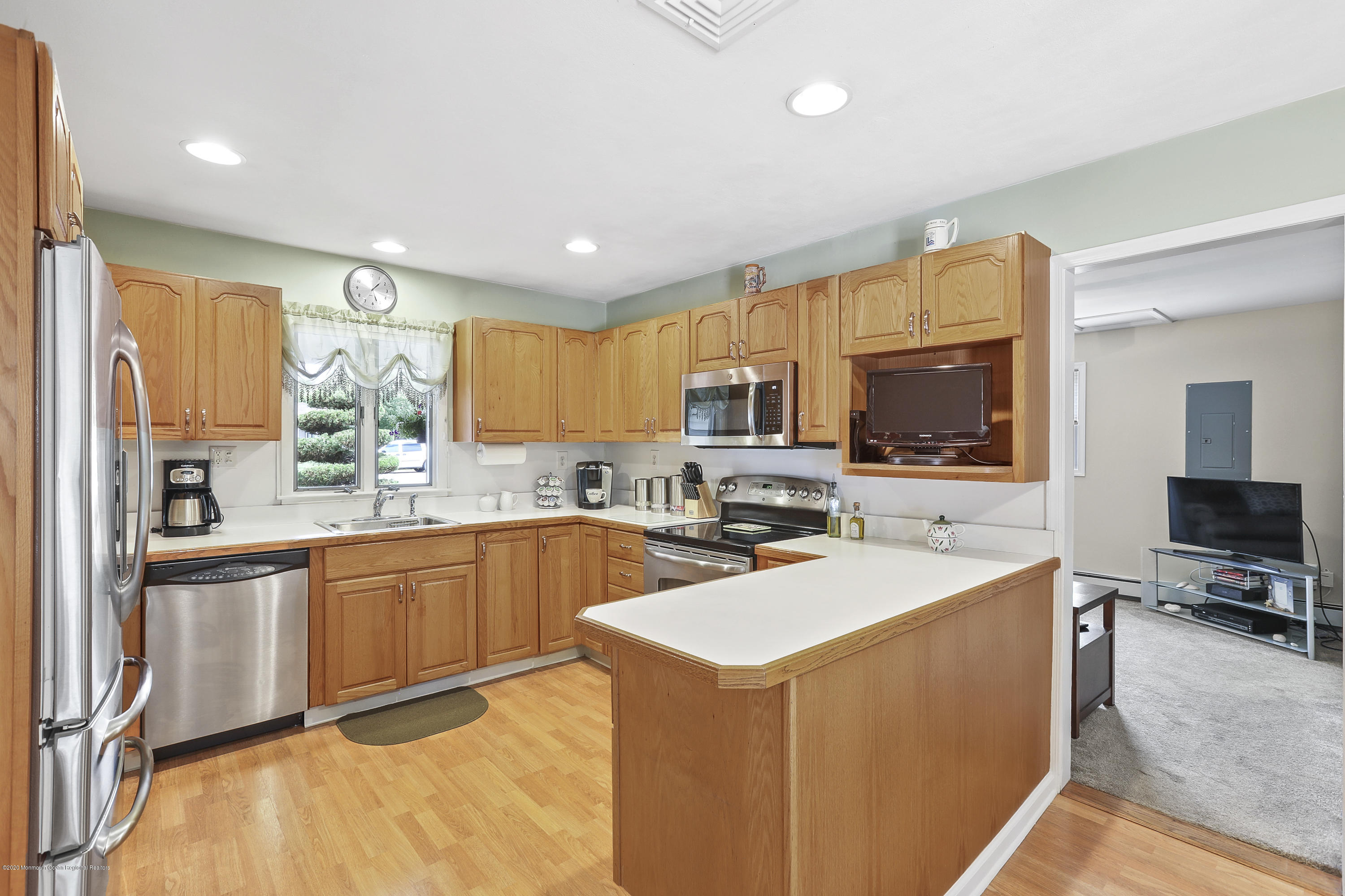 16 Donna Place Aberdeen, NJ 07747 - Photo 10 of 27 16 DONNA PLACE KITCHEN VIEW INTO DEN TV