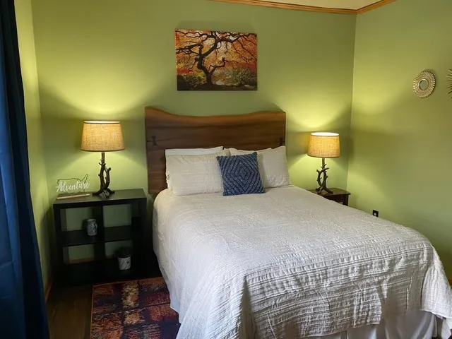 a view of a patio with table and chairs potted plants with wooden floor