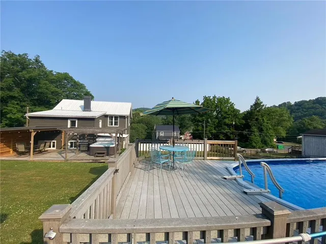 a view of house with yard outdoor seating and green space