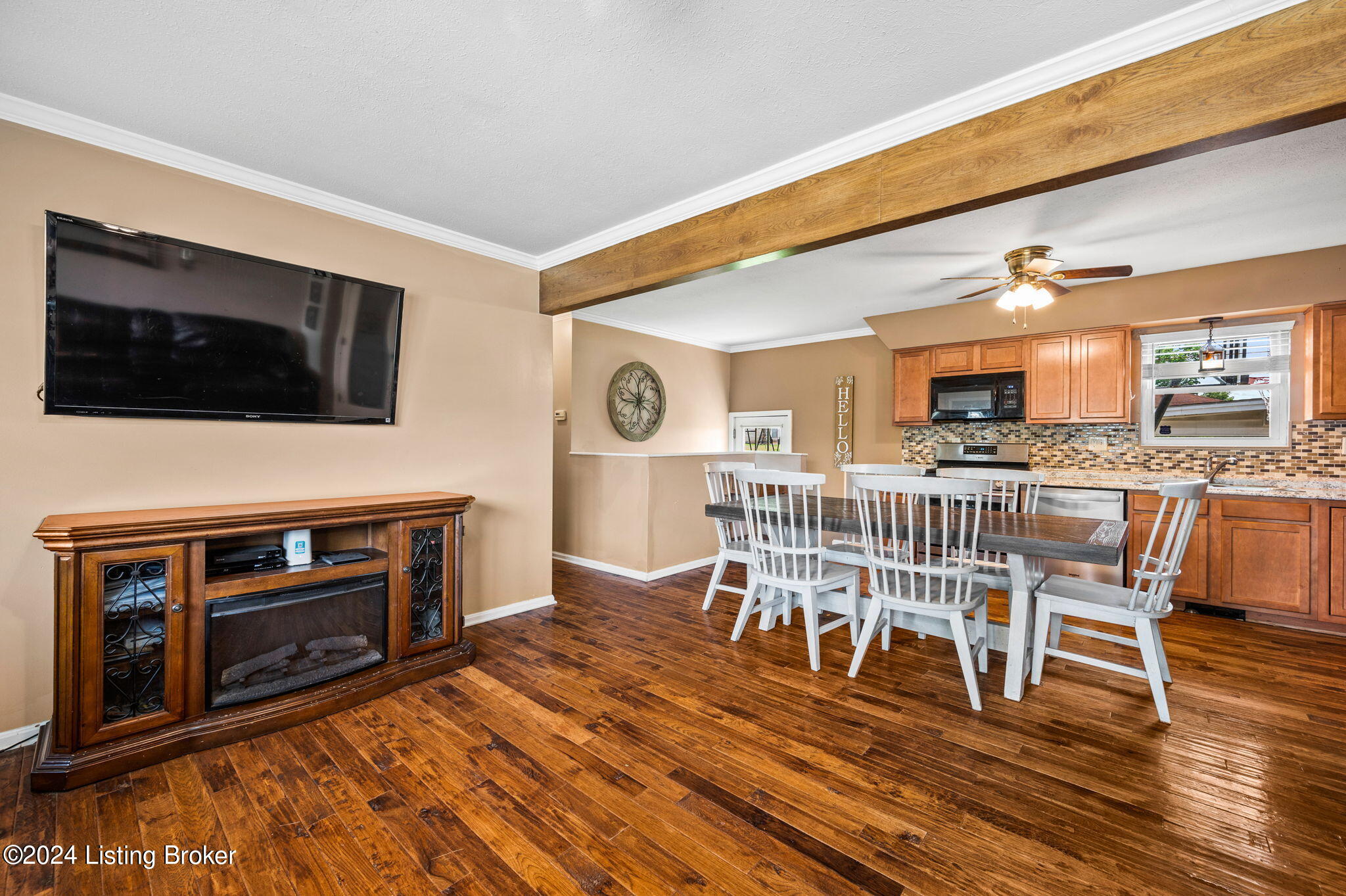 Gorgeous three-quarter inch hickory hardwood flooring graces the entire main level