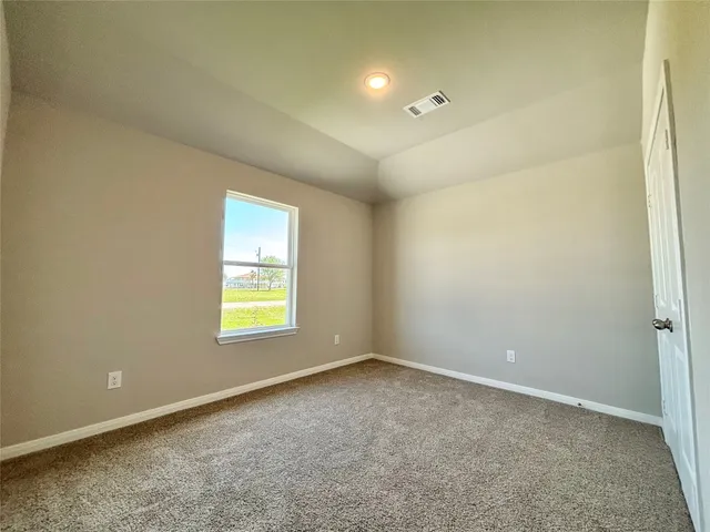 wooden floor and window in an empty room