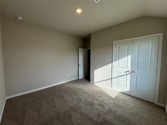 an empty room with sliding door