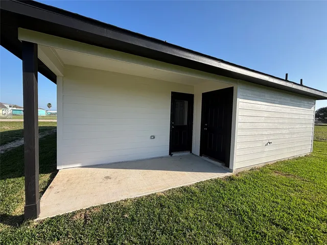 a view of backyard with seating space