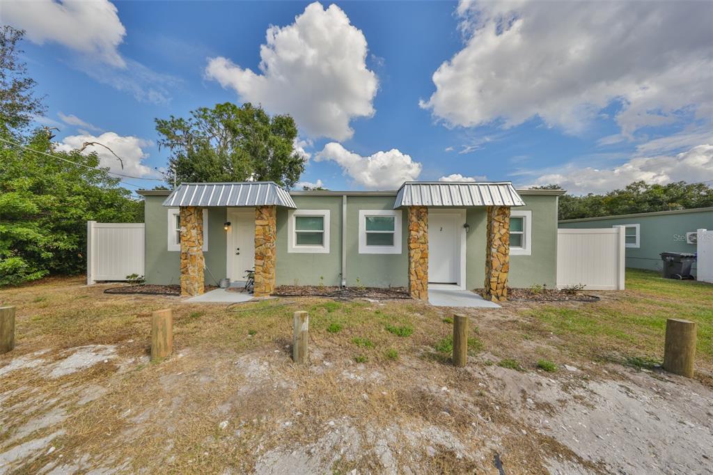 11708 Balm Riverview Road Riverview, FL 33569 - Photo 1 of 37 a front view of a house with a garden and yard