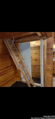 a living room with a black chair