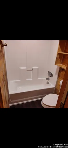a bathroom with a sink a toilet and a bathtub