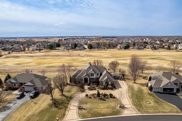 a view of walk in closet with clothes