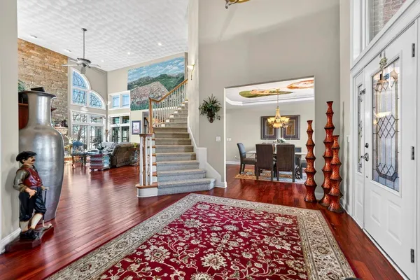 a bedroom with a bed dresser and a window