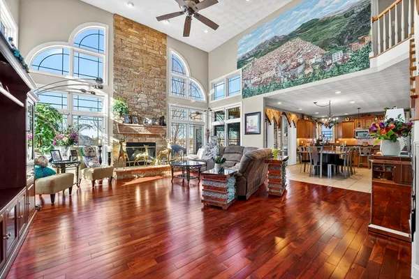 a bedroom with a bed a dresser and a window