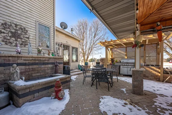 a view of a livingroom with furniture and a flat screen tv