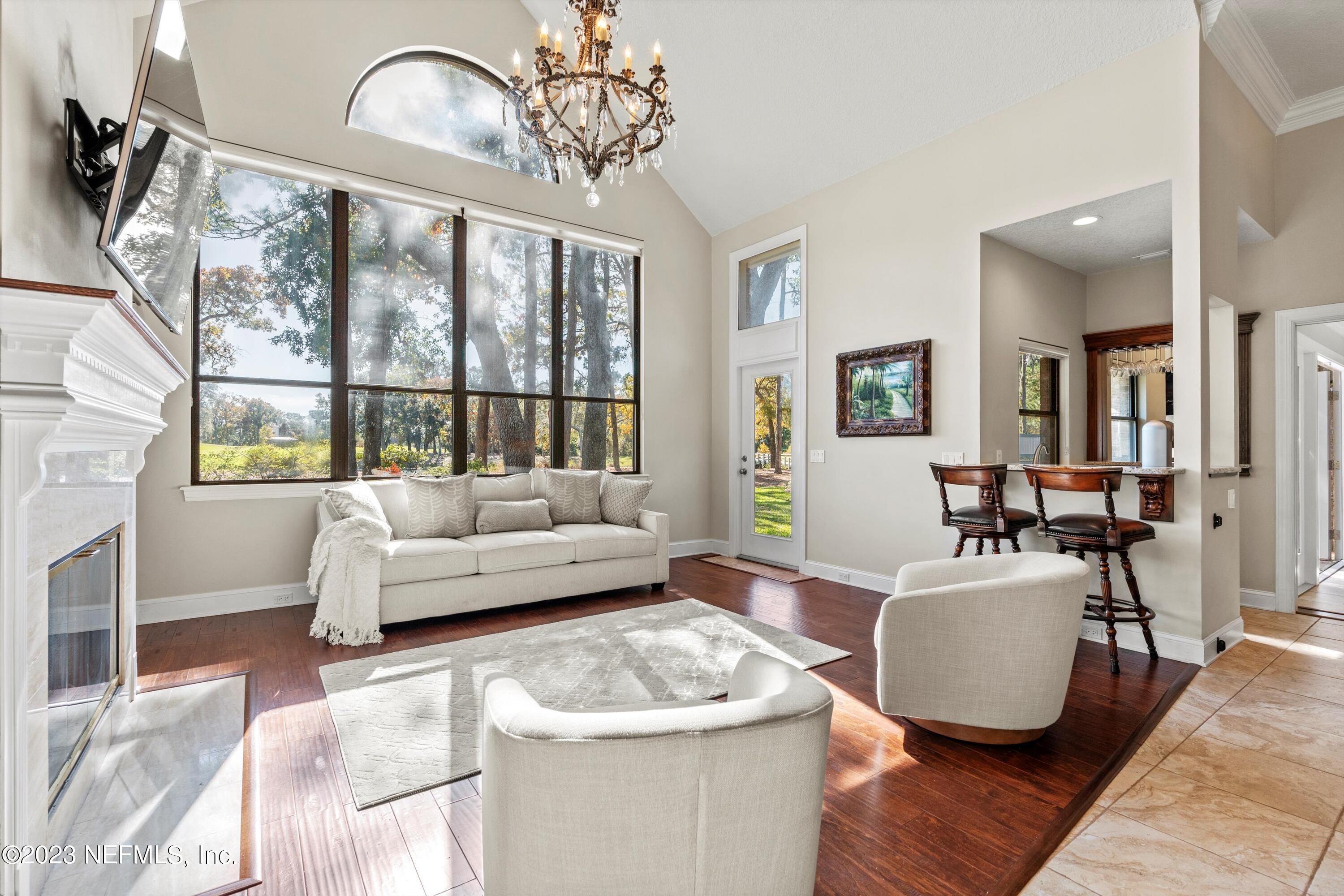 13062 Biggin Church Road South Jacksonville, FL 32224 - Photo 13 of 56 a living room with furniture and a large window