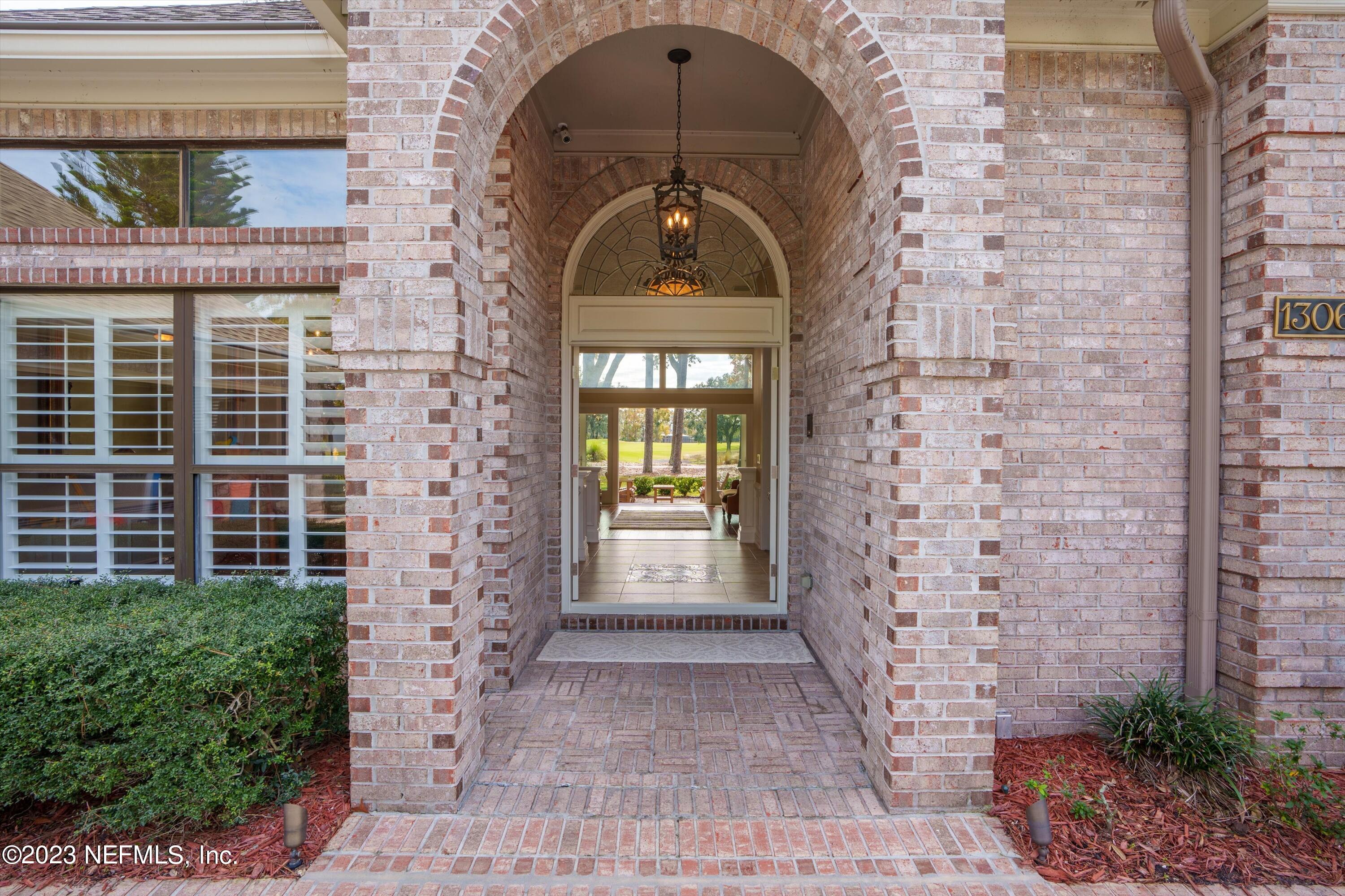 13062 Biggin Church Road South Jacksonville, FL 32224 - Photo 2 of 56 a front view of a house with large windows