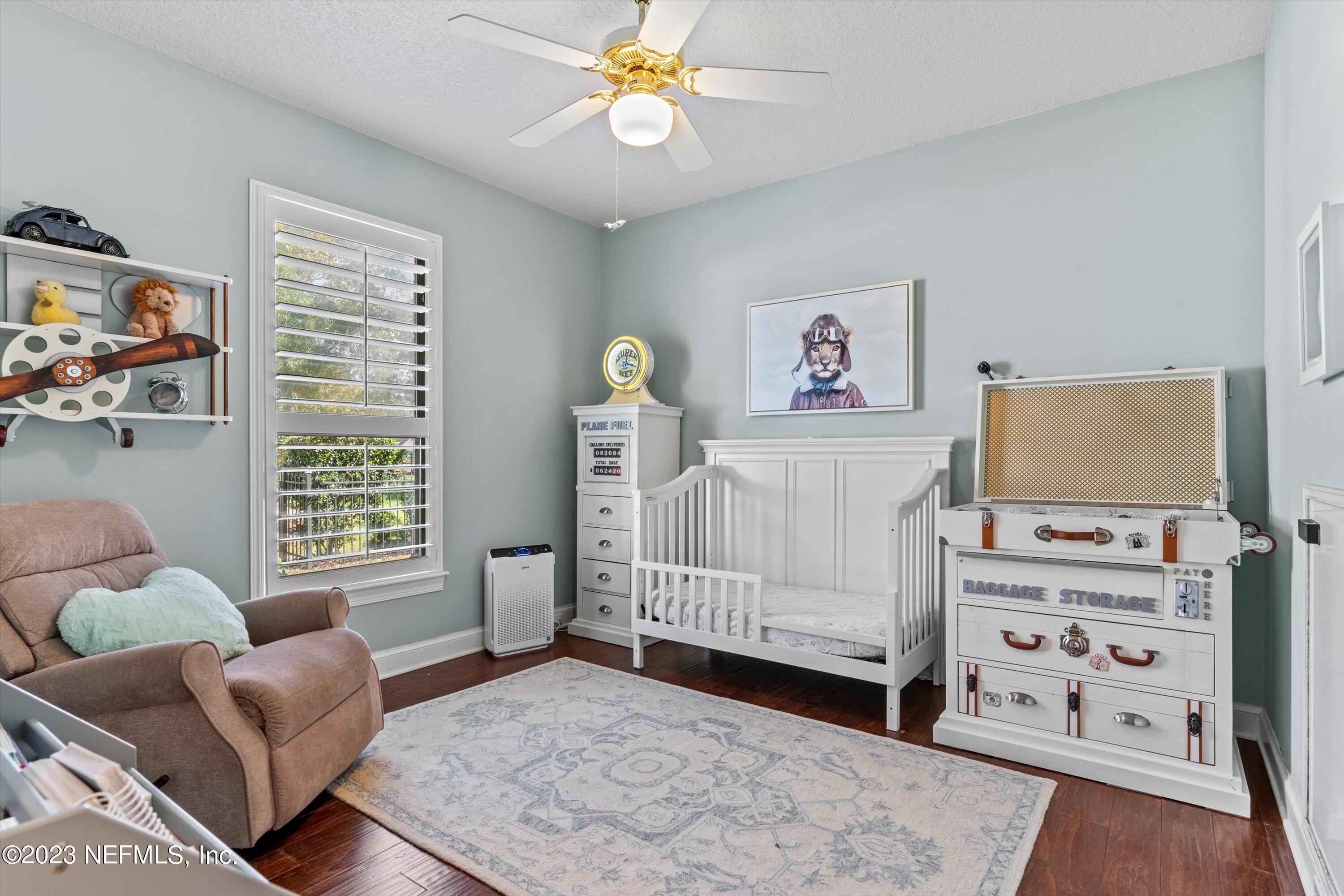 13062 Biggin Church Road South Jacksonville, FL 32224 - Photo 21 of 56 a bedroom with furniture and a window