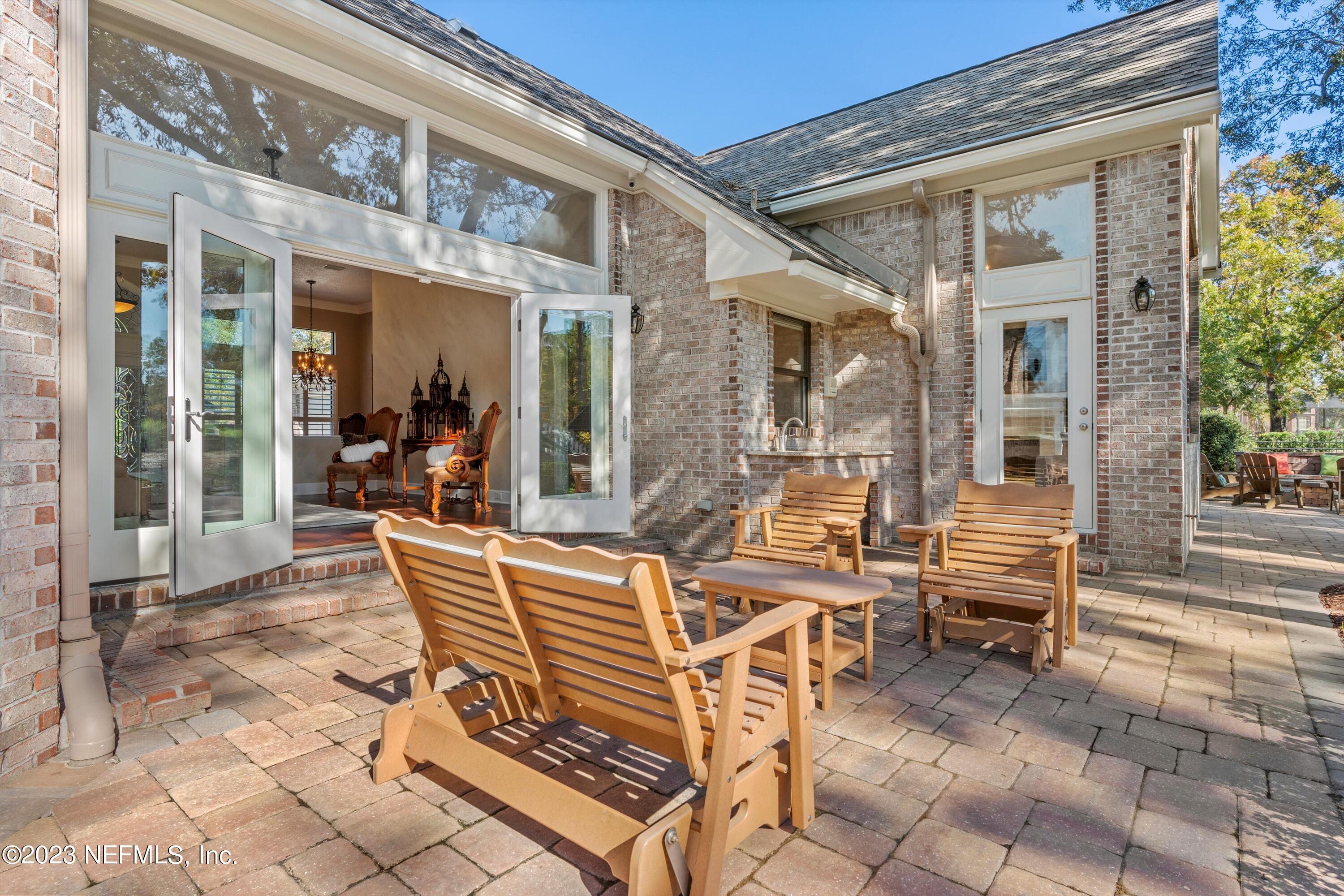 13062 Biggin Church Road South Jacksonville, FL 32224 - Photo 24 of 56 a view of a patio with couches table and chairs and potted plants