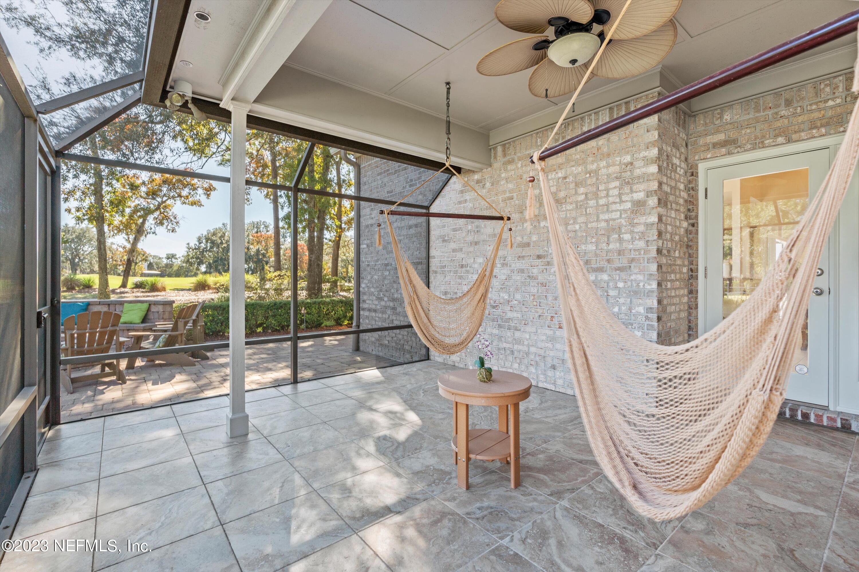 13062 Biggin Church Road South Jacksonville, FL 32224 - Photo 29 of 56 a view of a porch with a table and chairs