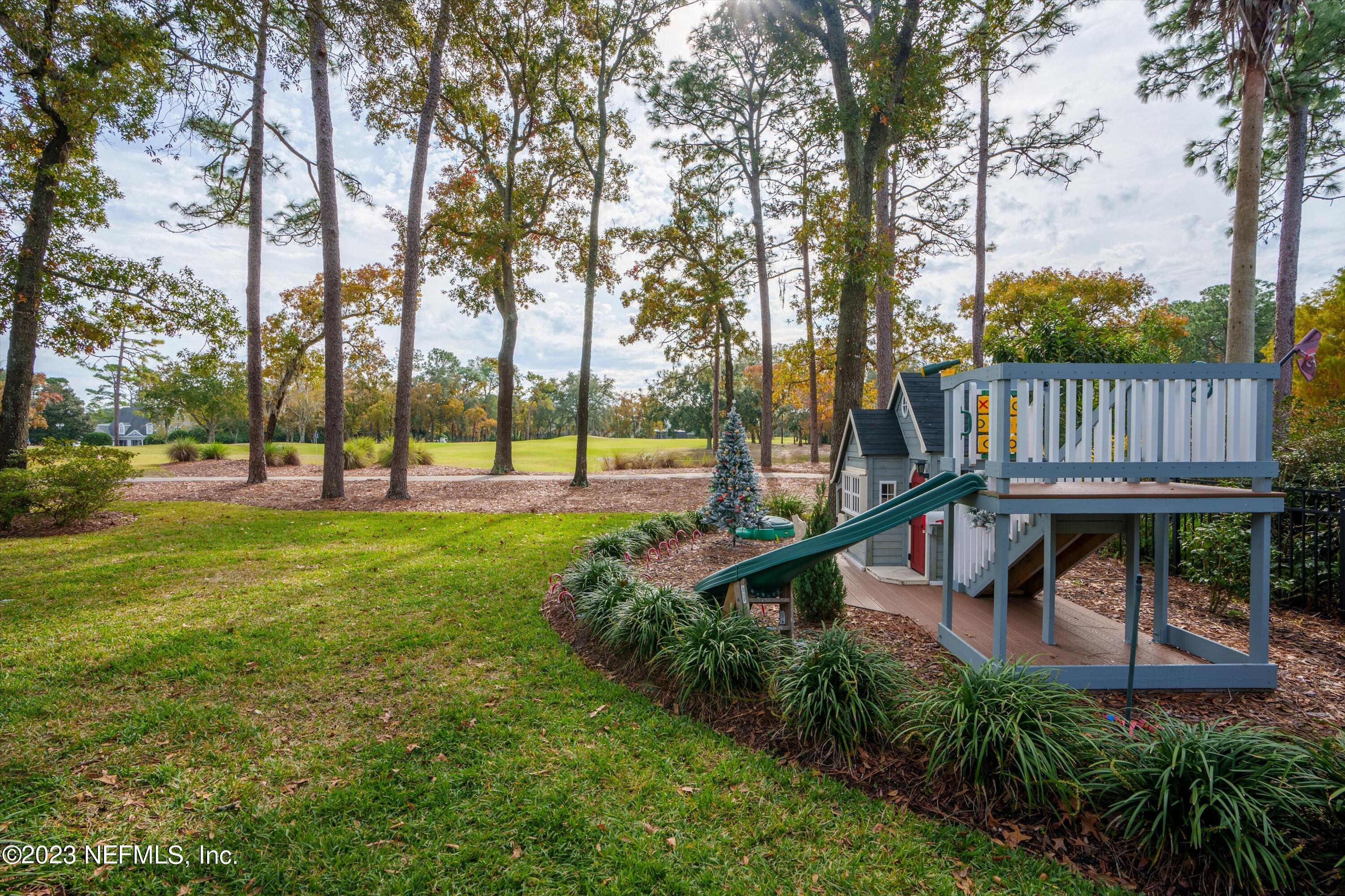 13062 Biggin Church Road South Jacksonville, FL 32224 - Photo 33 of 56 a view of a garden with swimming pool