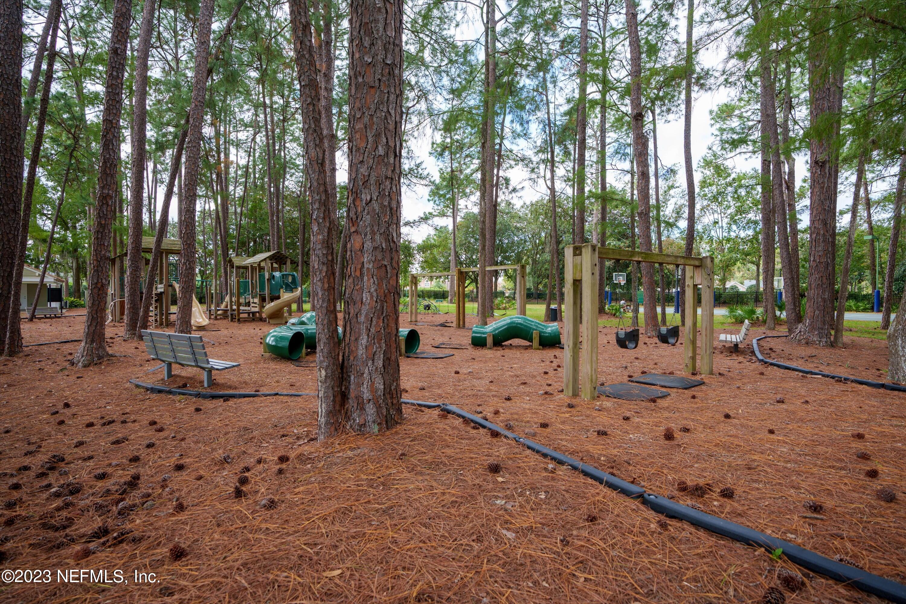 13062 Biggin Church Road South Jacksonville, FL 32224 - Photo 50 of 56 a view of a backyard with large trees and a small barn