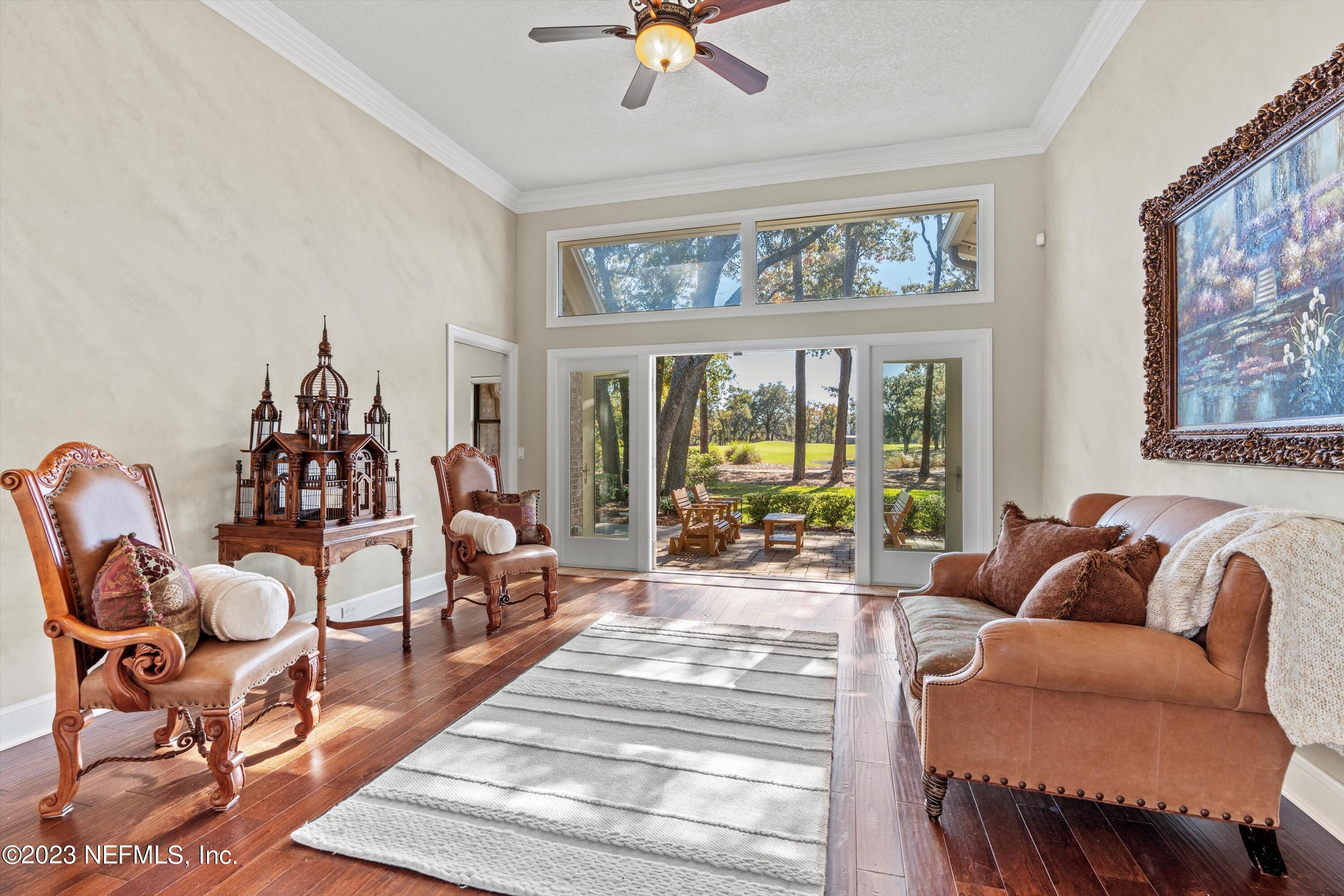 13062 Biggin Church Road South Jacksonville, FL 32224 - Photo 5 of 56 a living room with furniture and a large window