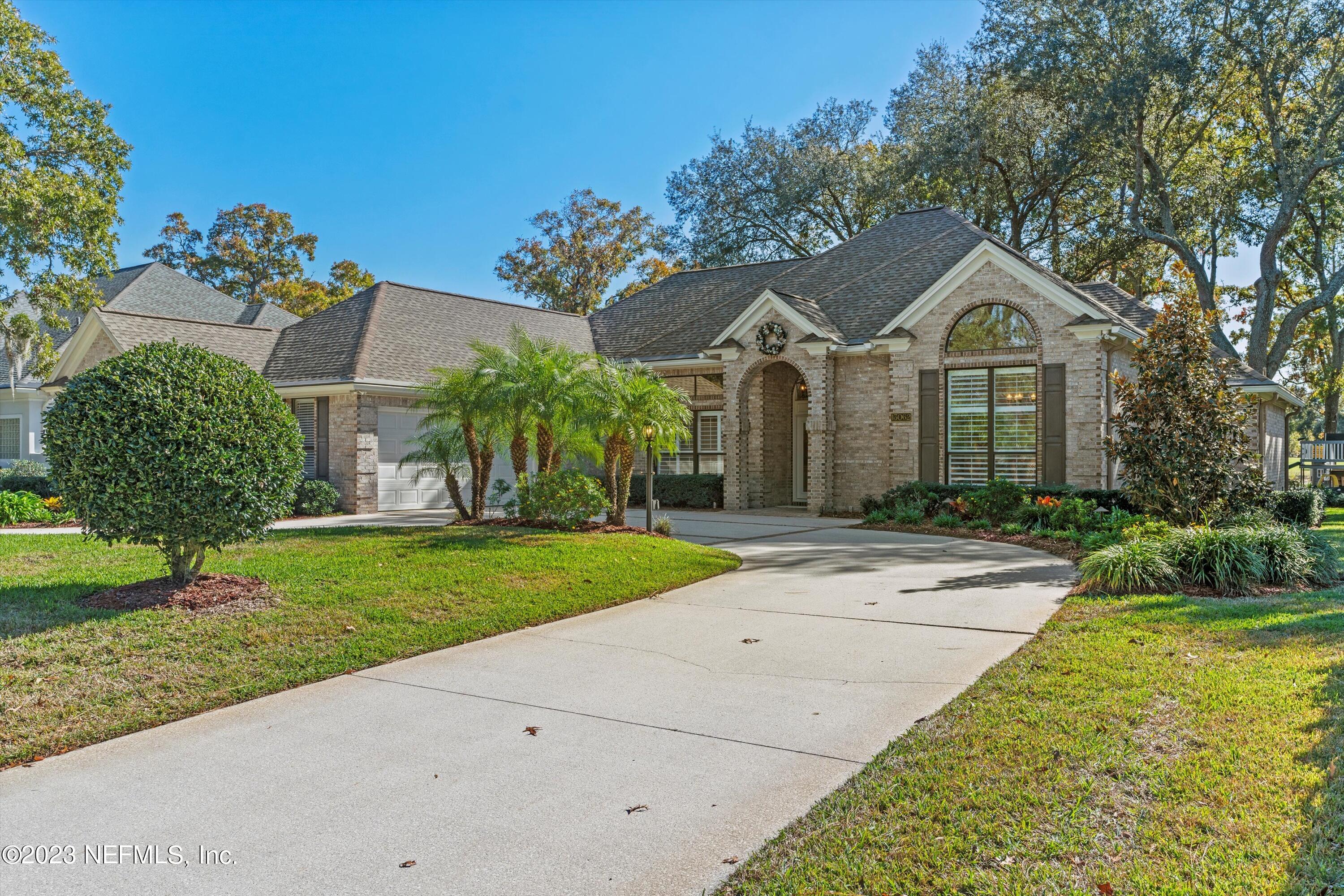 13062 Biggin Church Road South Jacksonville, FL 32224 - Photo 54 of 56 a front view of a house with a yard and garage