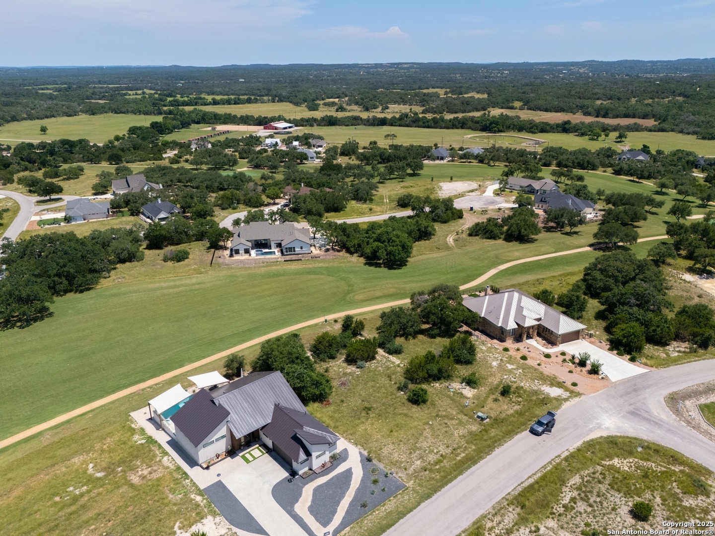 227 Lewis Todd Blanco, TX 78606 - Photo 3 of 12 an aerial view of residential houses with outdoor space