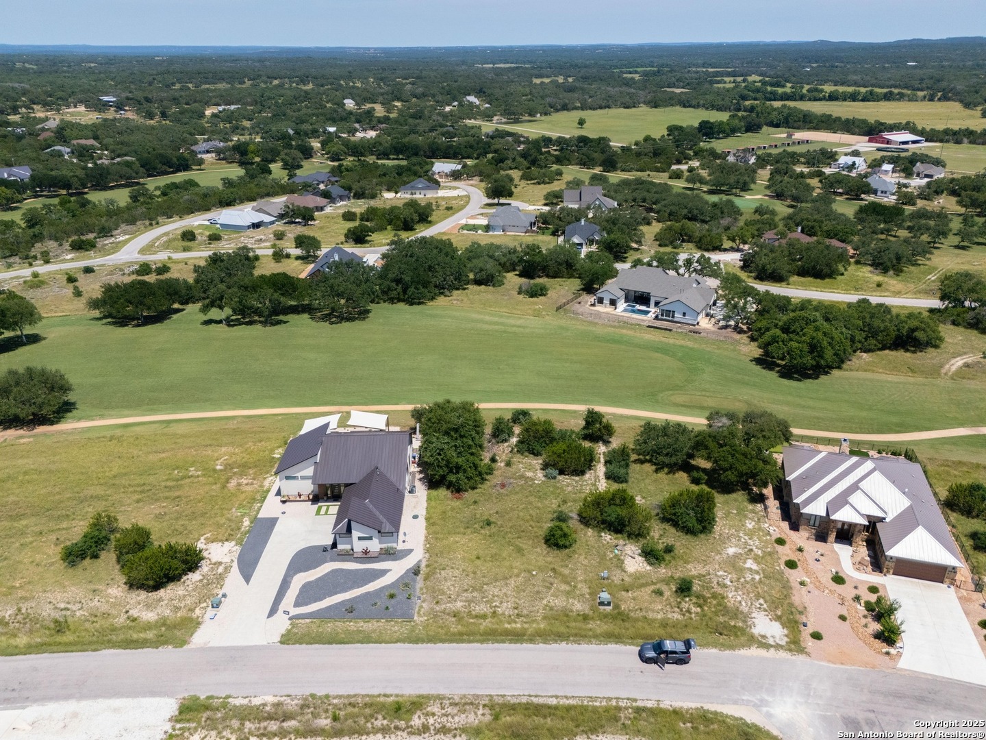 227 Lewis Todd Blanco, TX 78606 - Photo 8 of 12 an aerial view of residential houses with outdoor space