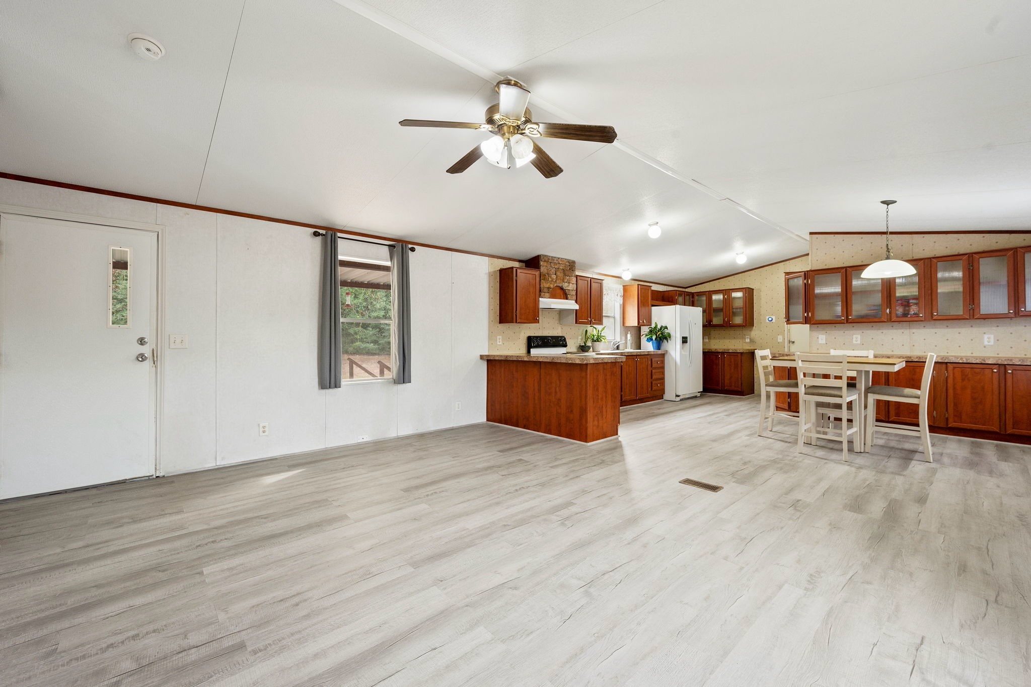 6493 Pappas Road Waller, TX 77484 - Photo 32 of 32 Alternate living area view showing seamless flow between the kitchen and dining zones in this 1,368 sq. ft. floor plan.
