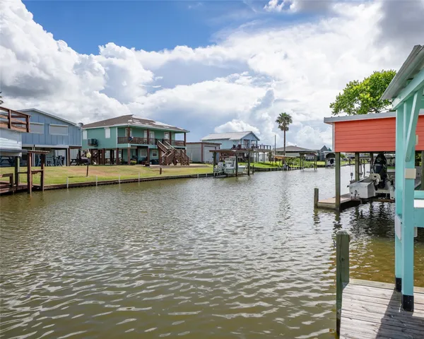 a view of a lake with boats and a large bridge