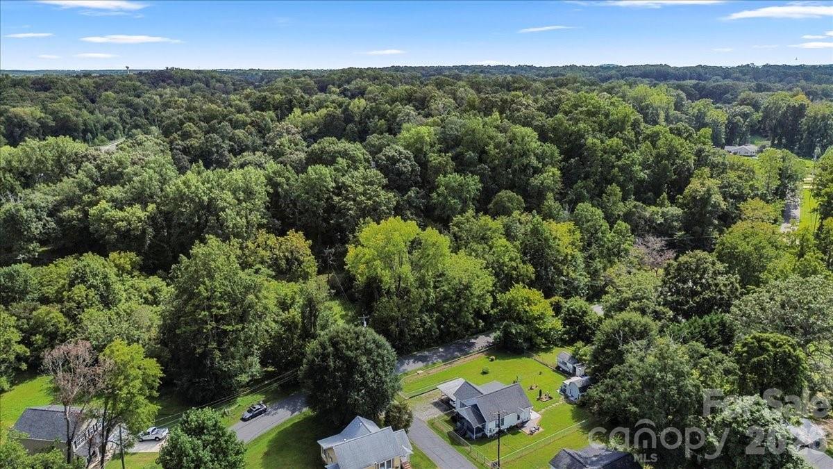 0 Bell Street Mount Holly, NC 28120 - Photo 9 of 10 an aerial view of residential houses with outdoor space and trees