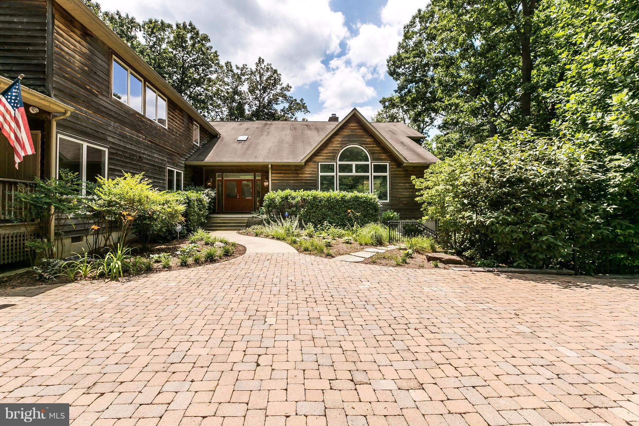 126 Gilbert Court Edgewater, MD 21037 - Photo 1 of 30 a front view of a house with a yard and potted plants