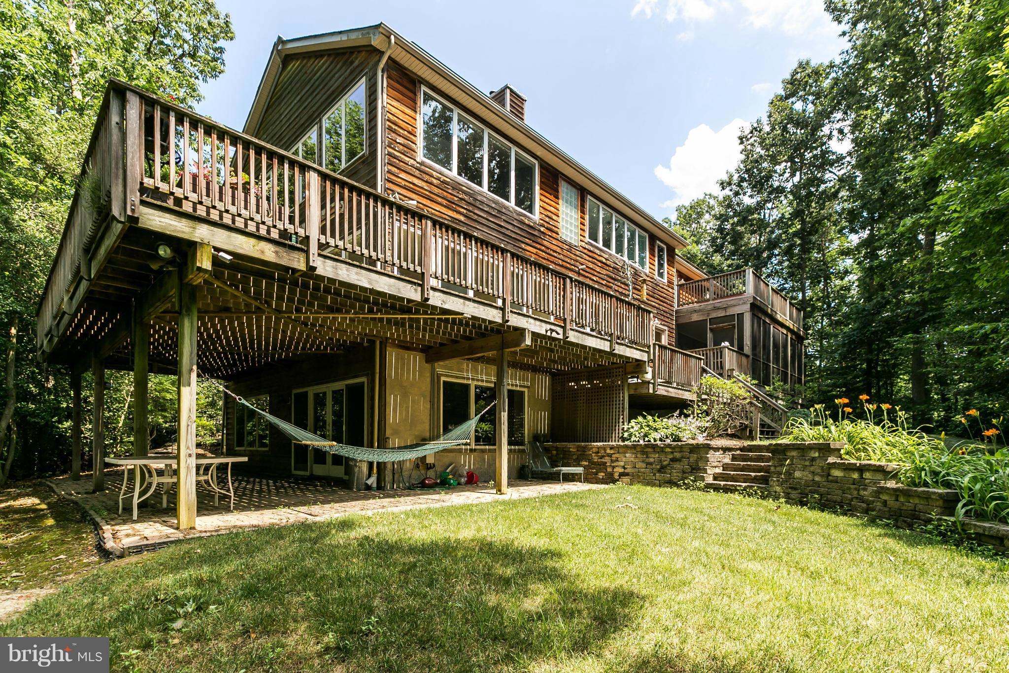 126 Gilbert Court Edgewater, MD 21037 - Photo 2 of 30 a view of an house with backyard and sitting area