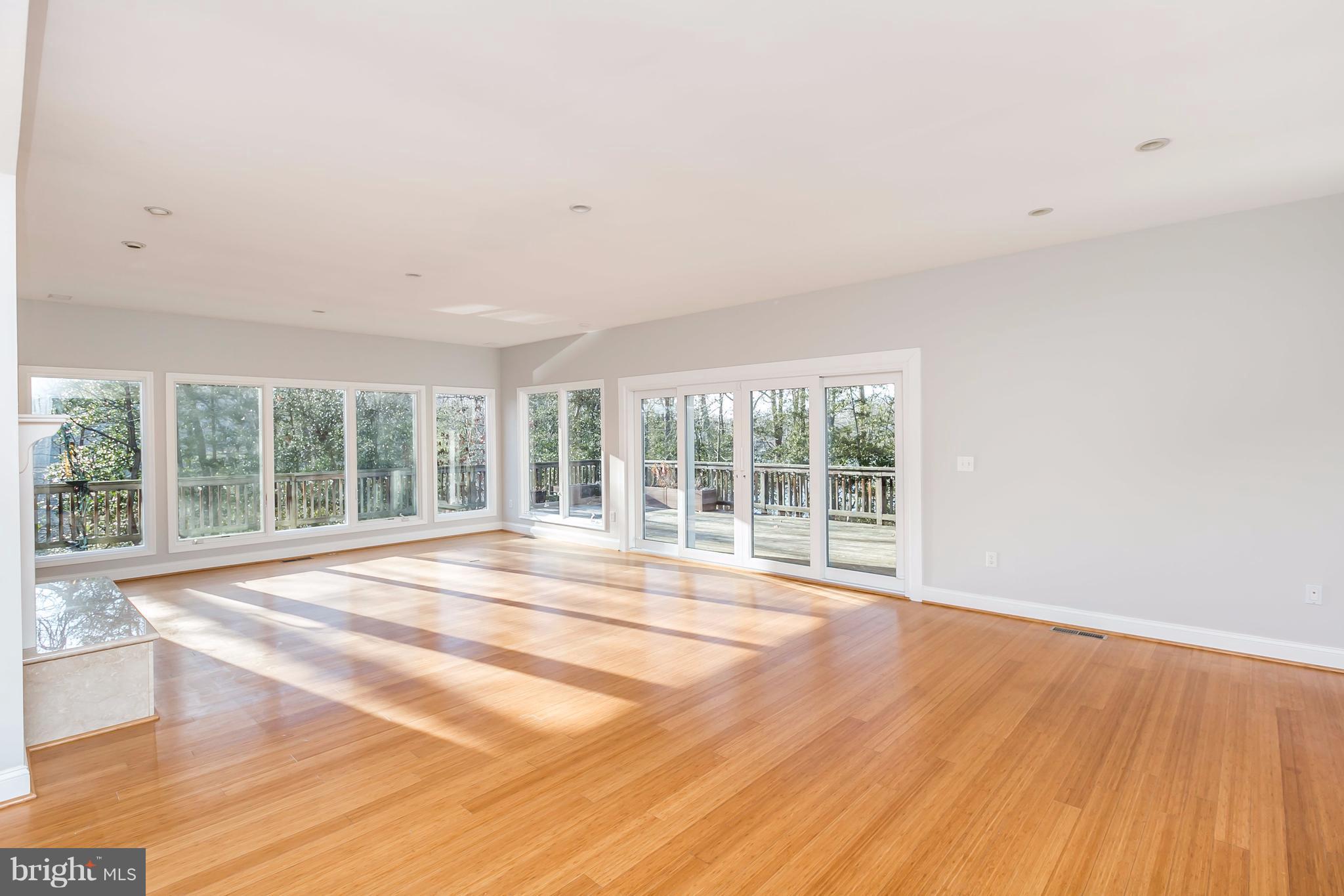 126 Gilbert Court Edgewater, MD 21037 - Photo 12 of 30 a view of an empty room with wooden floor and a window